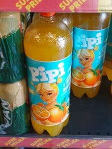 Bottles of Pipi orange drink on a shop shelf
